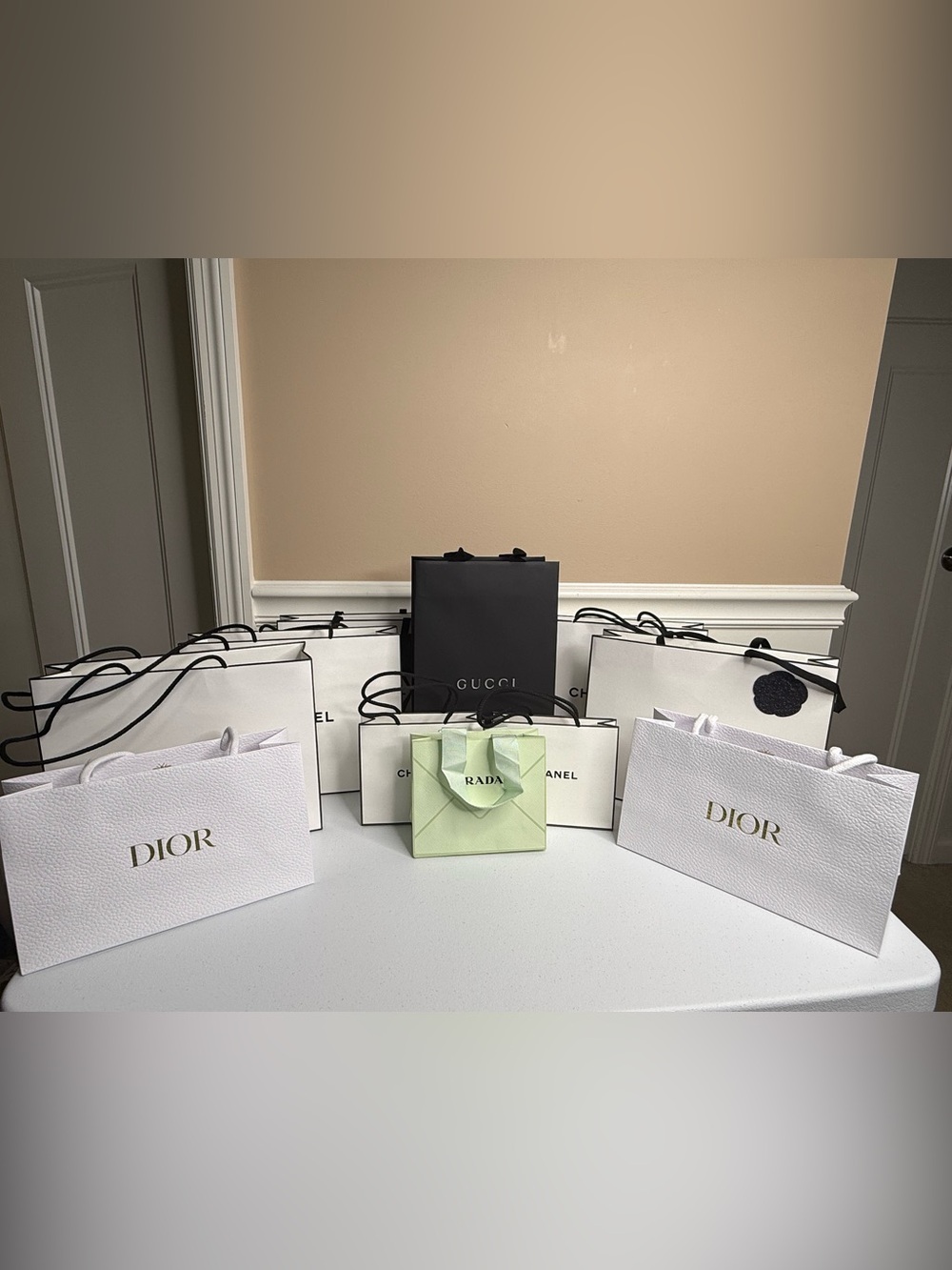 Luxury Shopping Bags, including Dior, Chanel, Prada, & Gucci.